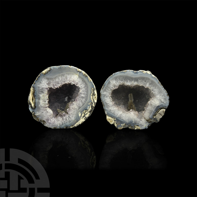 Cut and Polished Amethyst Crystal Geode Pair. A pair of cut and polished amethys...
