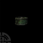 Viking Age Coiled Ring. 9th-12th century A.D. A coiled ring formed from a single length of bronze wire produced to varying thicknesses. 7.75 grams, 22...
