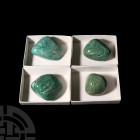 Large Polished Amazonite Pebble Group. A group of four polished amazonite mineral specimens; each held in a white card collector's tray. 785 grams tot...