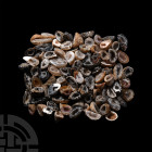 100 Cut Half Mini Geode Specimens. A group of one hundred mini cut geode halves, many displaying crystals to the exposed inner surfaces. 615 grams tot...
