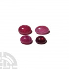 39.45 Carat Polished Ruby Cabochon Group. A group of four polished ruby cabochons; some show weak stars, 39.45 carats total. 7.89 grams total, 11-14 m...