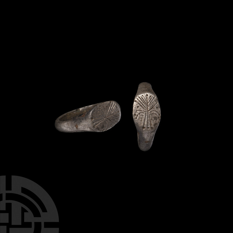 Merovingian Ring with Palm Tree. 6th-8th century A.D. A silver ring with circula...