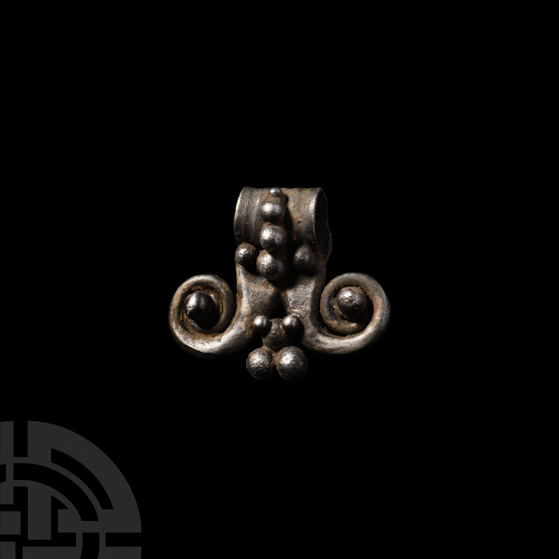 Germanic Silver Pendant. 5th-7th century A.D. A silver pendant with bifurcated a...