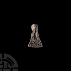 Viking Age Silver Axe Pendant. 9th-12th century A.D. A bifacial silver axe-shaped pendant with engraved notches on the blade and X O X motif, pierced ...