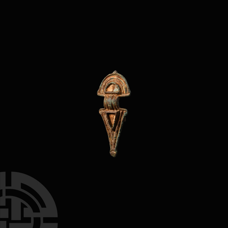 Anglo-Saxon Gilt Radiate Brooch. 6th century A.D. A radiate-headed brooch with r...