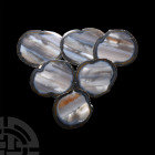 Polished Agate Slice Coaster Set. A group of six polished agate slices with grey fabric bases, suitable for use as coasters; colour enhanced. 490 gram...