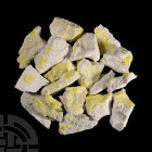 Sulphur Mineral Specimen Group. A group of eighteen specimens of sulphur of irregular shape. 1.06 kg total, 50-93 mm (2 - 3 3/4 in.) Mineral Imports, ...