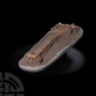 Argochampsa Fossil Crocodile Skull. Paleocene Period, 66-56 million years B.P. The upper part of a fossil Argochampsa krebsi crocodile skull on a sand...