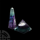 Fluorite Pyramid and Obelisk Pair. A cut and polished fluorite pyramid and obelisk; held in a white card collector's tray. 190 grams total, 46-80 mm (...