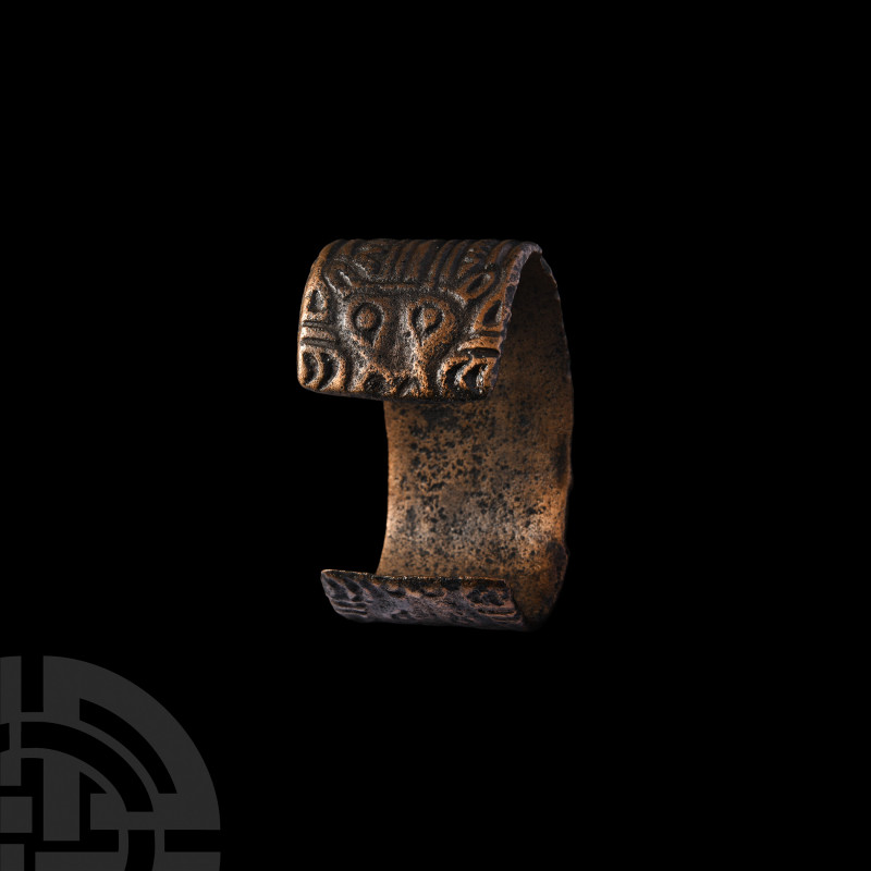 Viking Age Bracelet with Bear's Heads. 9th-11th century A.D. A flat-section pena...