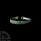 Anglo-Saxon Bracelet. 8th-9th century A.D. A bronze penannular bracelet with one pierced terminal. 9.08 grams, 49 mm (2 in.) Found Nottinghamshire, UK...