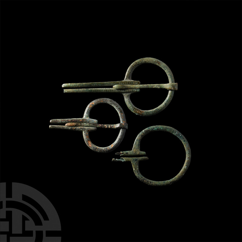 Viking Age Omega Cloak Brooches. 8th-11th century A.D. A set of three bronze ome...