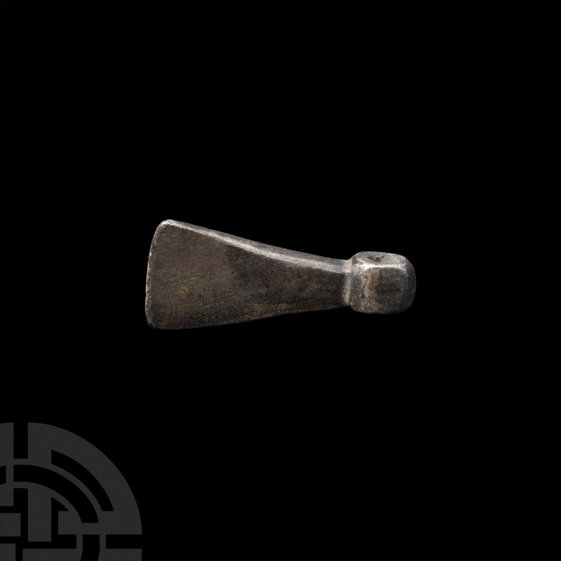 Viking Age Silver Axe Pendant. 9th-12th century A.D. A silver axehead pendant wi...