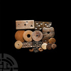 Medieval Bone Gaming Piece Collection. c.13th-16th century A.D. A mixed group of seventeen bone gaming pieces comprising: four dominoes; a piece decor...