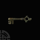 Large Medieval Door Key with Lozenge Handle. 14th-15th century A.D. A bronze key with lozengiform bow, collared round-section shank and rectangular wa...
