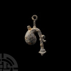Medieval Bagpipe Pilgrim's Badge. 15th century A.D. A pilgrim's badge modelled three dimensionally in the form of bag pipes; arm with suspension loop....