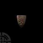 Medieval Heraldic Horse Harness Stud with Bird. 13th-14th century A.D. A shield-shaped horse harness stud bearing a stylised bird standing left; remai...