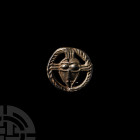 Medieval Christ's Face Pilgrim's Badge. c.12th-13th century A.D. A pilgrim's badge representing the nimbate face of Christ, formed with a circular fra...