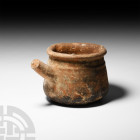 British Medieval Ceramic 'Thames' Pipkin. 14th century A.D. A ceramic pipkin with roughly drum-shaped body, rolled rim with shallow pouring lip and ro...