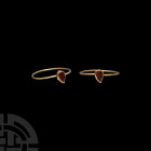 Medieval Gold Ring with Teardrop Garnet. 13th century A.D. A tear-shaped bezel set with cut and polished garnet, attached to a later gold hoop. Cf. Ch...