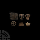 Medieval Pilgrim Badge Fragment Group. 13th-15th century A.D. A mixed group of pilgrim badge fragments of various designs. 25.2 grams total, 18-35 mm ...