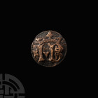 Medieval Horse Harness Roundel with Crowned I B. 14th-16th century A.D. A discoid harness roundel bearing the crowned initials IB, heart between, foli...