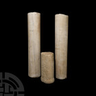Medieval Marble Column Section Group. 15th century A.D. or later. A group of three limestone pillar sections, two round-section with squared ends, one...