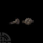 Medieval Ring with Eagle. 13th-15th century A.D. A bronze ring with flat-section hoop, columnar shoulders supporting a raised bezel with a stylised sp...