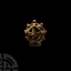 Medieval Openwork Sceptre Head. c.13th century A.D. A bulbous openwork sceptre or staff terminal decorated with raised pellets, rectangular-section so...