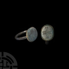 Medieval Ring with Cross. 12th-15th century A.D. A ring with D-section hoop and bevelled oval-shaped bezel engraved with a cross. 4.36 grams, 21.04 mm...