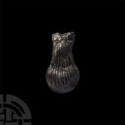 Medieval Pilgrim's Holy Water Ampulla. 12th-14th century A.D. A pilgrim's ampulla composed of a piriform body with broad, everted neck, decorative str...