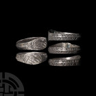 Medieval Silver 'Clasped Hands' Fede Ring with Inscription. 15th century A.D. A silver fede ring composed of a carinated hoop, expanded at the bezel w...
