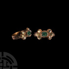 Georgian Gold Ring with Gemstones. 18th century A.D. A gold ring composed of an almost flat-section hoop, bifurcated openwork shoulders, each with a s...