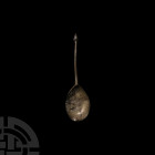 Acorn Topped Spoon with Maker's Mark. c.17th century A.D. A spoon composed of a tapering round-section stem and oval bowl, acorn finial and bowl stamp...