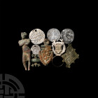 Artefact Group. 16th century A.D. and later. A mixed group of artefacts comprising: standing figure wearing a sailor's hat; pierced coin with Arabic t...