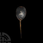 Tudor Spoon with Initials and Maker's Mark. 16th century A.D. A pewter spoon with large oval bowl and hexagonal-sectioned stem, bowl stamped 'TVS' wit...