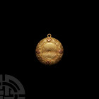 'The Peckleton' Gold Georgian Vinaigrette. 18th century A.D. A locket-style hinged gold vinaigrette comprising two circular domed faces, lentoid in se...