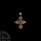 Silver Cross Pendant. 17th-19th century A.D. A silver cruciform pendant bearing the figure of Christ on the cross with elaborate arms in low-relief, a...