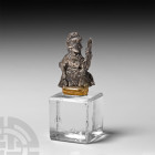 Victorian Silver Britannia Seated Statuette. 19th century A.D. A silver plaque formed as Britannia seated right, wearing crested helmet, long robes an...