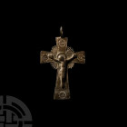 Cross Pendant. 17th-18th century A.D. A bronze pectoral cross, plain on the reverse, the obverse with nimbate corpus Christi on the cross, four inscri...