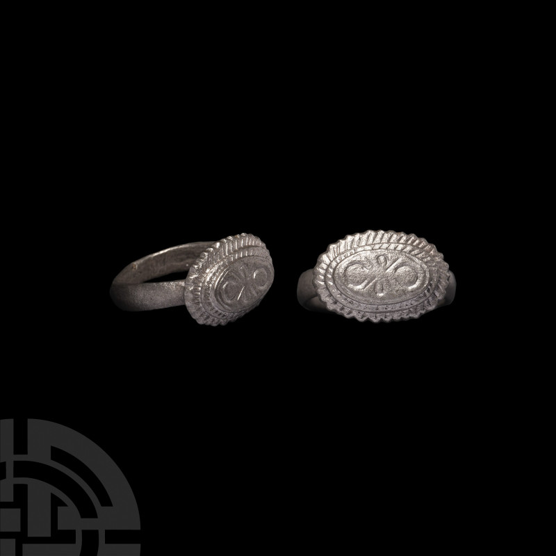 Silver Ring with Bow. 17th-18th century A.D. A gilt silver ring composed of a D-...