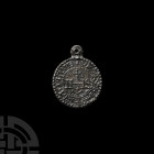 IHS St Benedict Pendant Medal. 18th-19th century A.D. A bifacial discoid pendant medal with flat-section body and pierced suspension lug: side one wit...