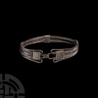 Tudor 'Thames' Silver Multi-Strand Bracelet. Late 15th-16th century A.D. A silver bracelet composed of multiple strands of twisted silver wire and fla...