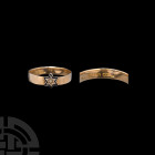 Gold Mourning Ring with Star. 1899 A.D. A gold mourning ring with star on bezel decorated with black enamel and central stone, hallmarked Birmingham a...