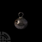 Stuart Period Silver Button. 17th century A.D. A silver button with bulbous head and slender suspension loop, stamped with maker's mark 'RW' in a sub-...