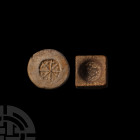 Tudor Gaming Piece Mould Group. 15th-16th century A.D. A discoid ceramic mould for a gaming token designed as a circle bisected with multiple arms, si...