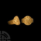 Tudor Gold Rose Ring. Late 16th-early 17th century A.D. A gold ring composed of a D-section hoop and discoid bezel decorated with a Tudor rose in reli...