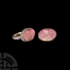 Silver Ring with Gemstone. 18th-19th century A.D. A silver D-section hoop supporting an ellipsoid bezel cell with notches and chevrons to the rim; ins...