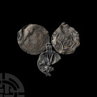 Lead Seal and Badge Collection. 16th-17th century A.D. A group of three discoid lead seals and badges comprising: a seal displaying a dragon or griffi...