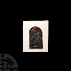 Pewter Pilgrim's Badge. 17th century A.D. An arch-shaped pewter pilgrim's badge bearing crowned Mary and robed Christ holding globe in raised relief, ...